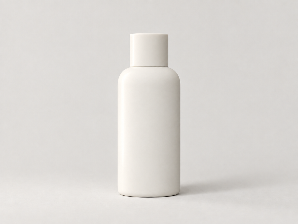 The same bottle with a directional side light, a lit edge, and a soft shadow that gives it volume